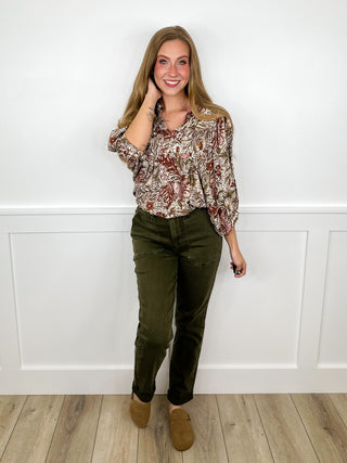 Floral long-sleeve blouse with olive green pants, worn with tan boots