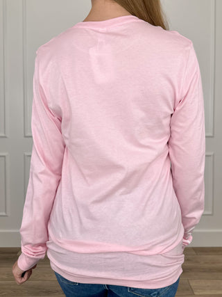 Back view of pink long-sleeve cotton graphic tee with crew neck