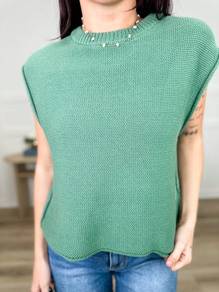 Cotton cap-sleeve sweater top in teal knit with crew neckline and slightly curved hem