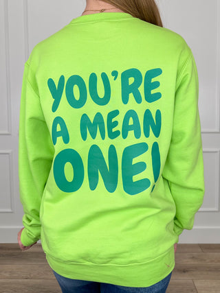 Lime green crewneck sweatshirt with large "YOU'RE A MEAN ONE" graphic on the back.