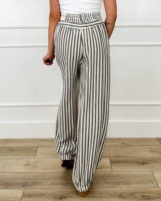 Back view high-rise striped cotton pants with elastic waistband and drawstring