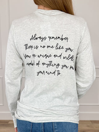 Light grey long-sleeve T-shirt with black script graphic on the back