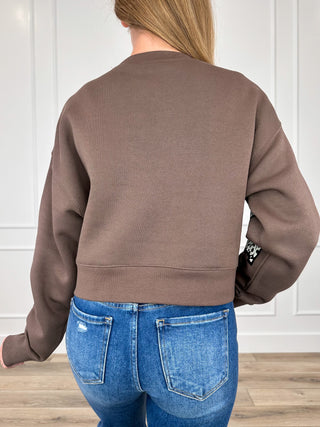 Brown cropped crewneck sweatshirt back view with long sleeves and plain design