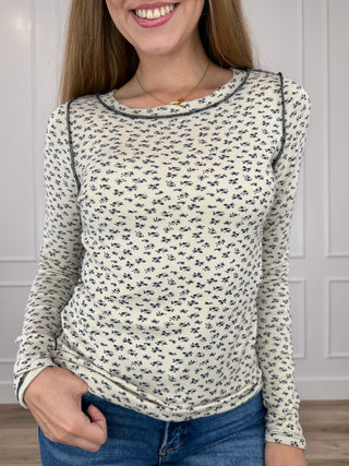 Oat knit long-sleeve top with small black print, crew neck