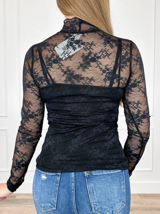 Sheer mesh long sleeve top with mock neck, black floral pattern, back view