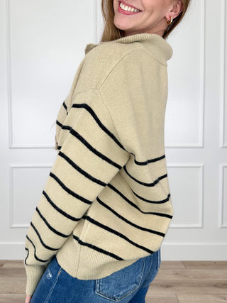 Tan knit long-sleeve hooded sweater with navy horizontal stripes and snap cuffs