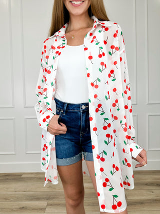 Lightweight long-sleeve button-up top, white with red cherry print and open front