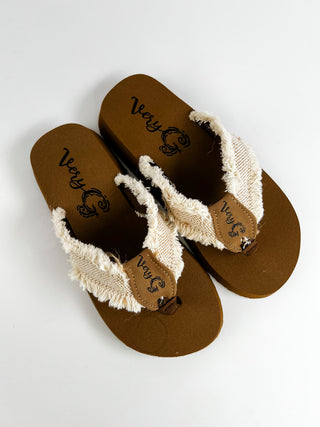 Natural canvas thong sandals with frayed straps, brown footbed with Very G logo