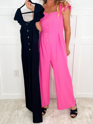 Pink cotton Avery Mae jumpsuit with button front and wide legs, shown with navy option