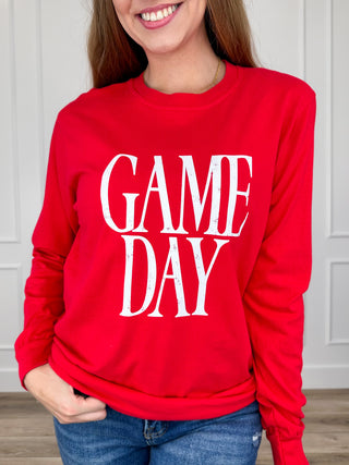 Red long-sleeve graphic tee with white “GAME DAY” lettering on the front