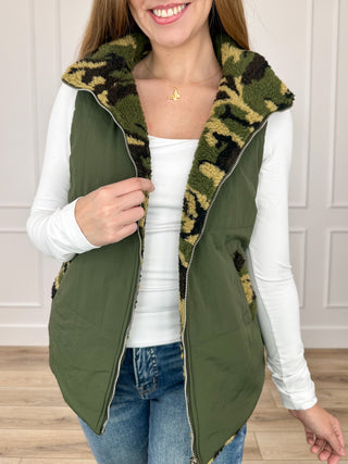 Reversible green vest with camo sherpa lining and front zipper