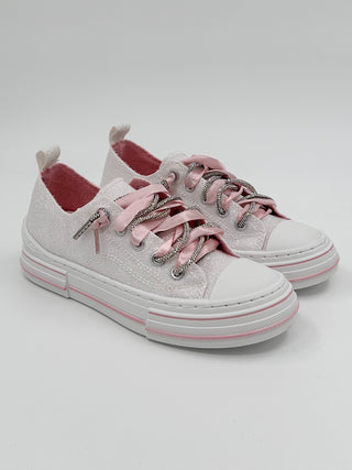 White canvas sneakers with pink laces, metal eyelets, and red heel lining