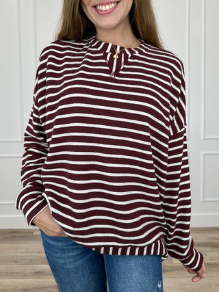 Knit long-sleeve top in burgundy and white stripes with buttoned half-placket