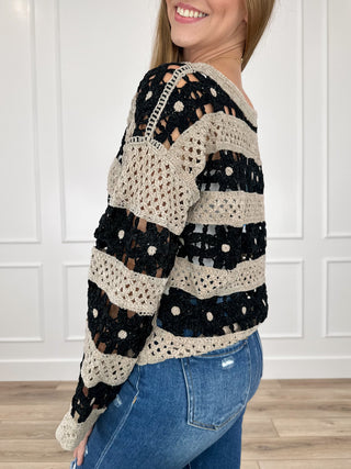 Cropped knit sweater, long sleeves, black with cream stripe bands and dot pattern