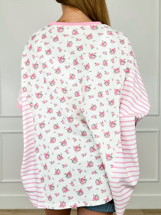 White cotton top with pink floral print and pink striped sleeves, back view