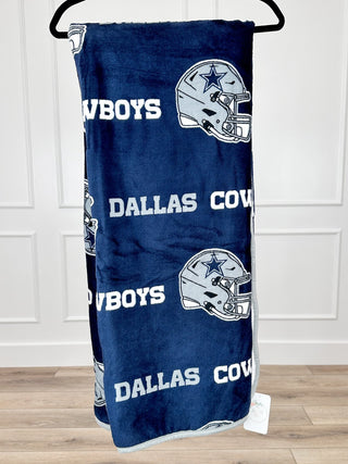 Blue Dallas Cowboys sherpa blanket with repeated helmet and text graphics