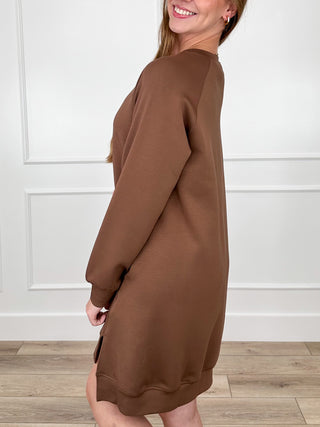 Brown long-sleeve crew-neck shift dress in relaxed fit, side view