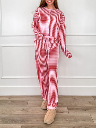 Pink-and-white striped knit set: long-sleeve top with drawstring wide-leg pants.