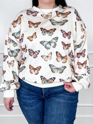 Cream long-sleeve crewneck sweatshirt with full butterfly print, front view