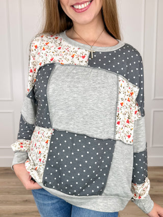 Long sleeve knit top in grey heather with floral and polka-dot patch panels