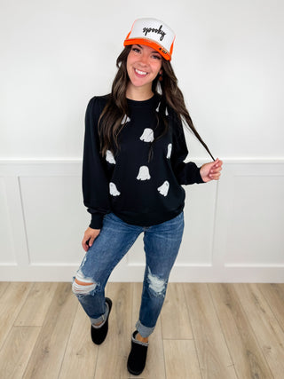 Outfit 2768: black printed sweatshirt, blue jeans, orange cap, black boots