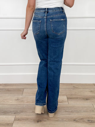 Women's medium wash straight-leg tummy control jeans, back view, non-distressed
