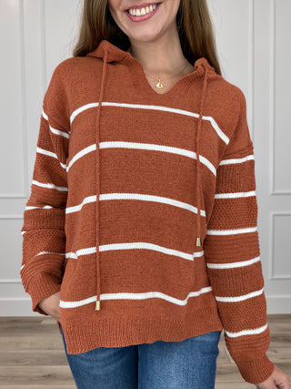 Rust orange striped knit hooded long-sleeve sweater with drawstring hood