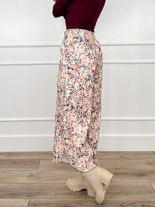 Cream wide-leg cropped pants in multicolor floral print, loose gathered waist