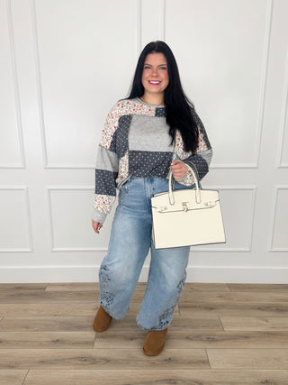 Grey knit long-sleeve top with multicolor patterned yoke and contrasting side panels