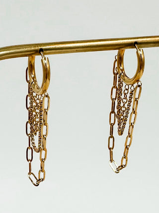 Gold drop earrings with small hoop top and layered dangling chains, gold-tone.