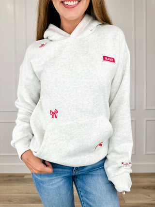 Light grey hoodie with hood, long sleeves, front pocket, red bow embroidery
