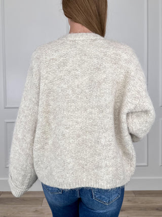 Oatmeal knit long-sleeve cardigan, back view with ribbed hem and cuffs
