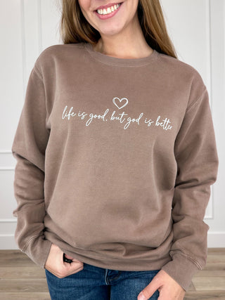 Brown crewneck sweatshirt with long sleeves and heart graphic front