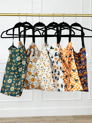Hanging Halloween candy bags with floral, skull, web, witch-hat, and cat patterns.