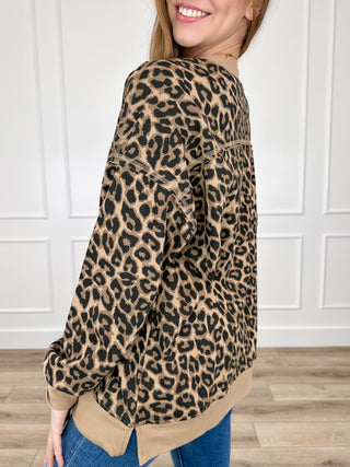 Leopard print long-sleeve top with high round neck and curved hem