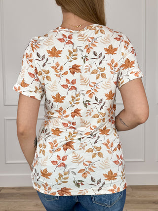 Ivory short-sleeve scoop-neck top with fall leaf print (back)