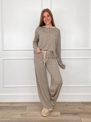 Sand-and-black striped knit set: long-sleeve top with drawstring wide-leg pants.