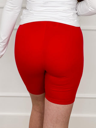 Red high-rise cotton blend biker shorts with folded hem and ruched waistband