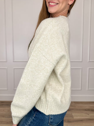 Oat knit long-sleeve sweater, crew neck and ribbed cuffs, side view