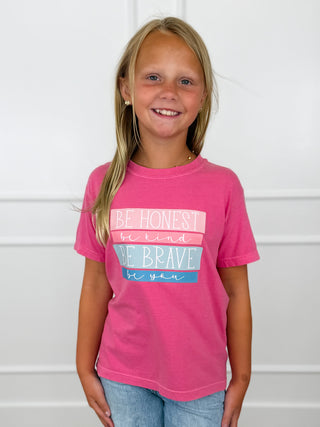 Kids cotton short-sleeve tee on child, pink with 'Be Honest, Be Brave' graphic