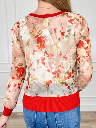 Sheer mesh cardigan with watercolor floral print and orange ribbed collar and hem, long sleeves
