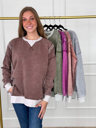 Women's brown long-sleeve V-neck pullover top with contrast white hem and cuffs