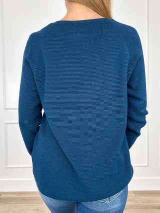 Blue knit long-sleeve sweater top, back view with crew neckline