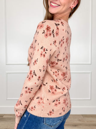 Pink floral knit long-sleeve sweater with crew neck and ribbed cuffs