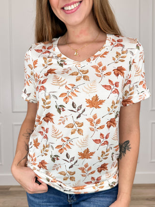 Ivory short-sleeve scoop-neck top with fall leaf print