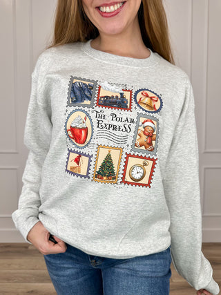 Grey long-sleeve crewneck sweatshirt with Polar Express stamp-style graphic