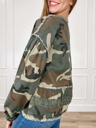 Camouflage long sleeve top with gathered ruffle cuffs and lace trim at hem