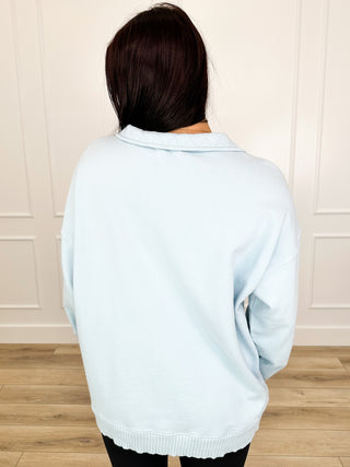 Light blue cotton pullover sweatshirt, back view, long sleeves, ribbed hem