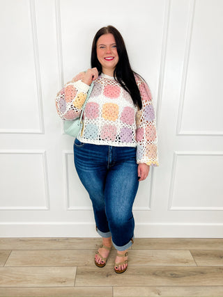 Multicolor crochet knit sweater with long sleeves and blue skinny jeans set