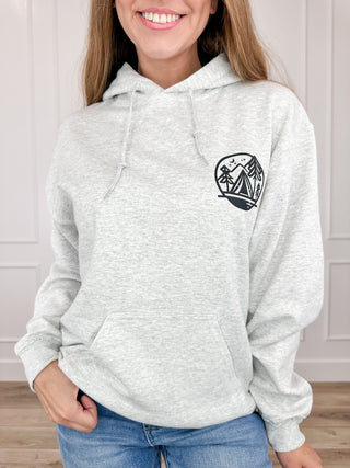 Grey long sleeve hoodie with small chest logo and pullover hood